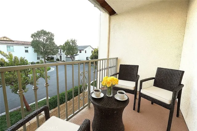 a view of a balcony with chairs