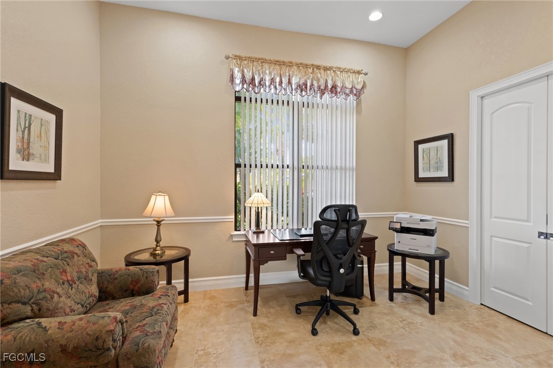 6057 Calusa Rdg Trail Bokeelia, FL 33922 - Photo 13 of 44 a view of a livingroom with workspace and a couch