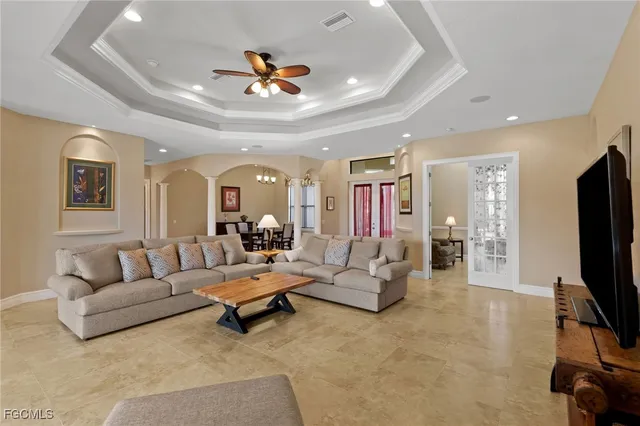 a kitchen with stainless steel appliances granite countertop a sink a stove and a refrigerator