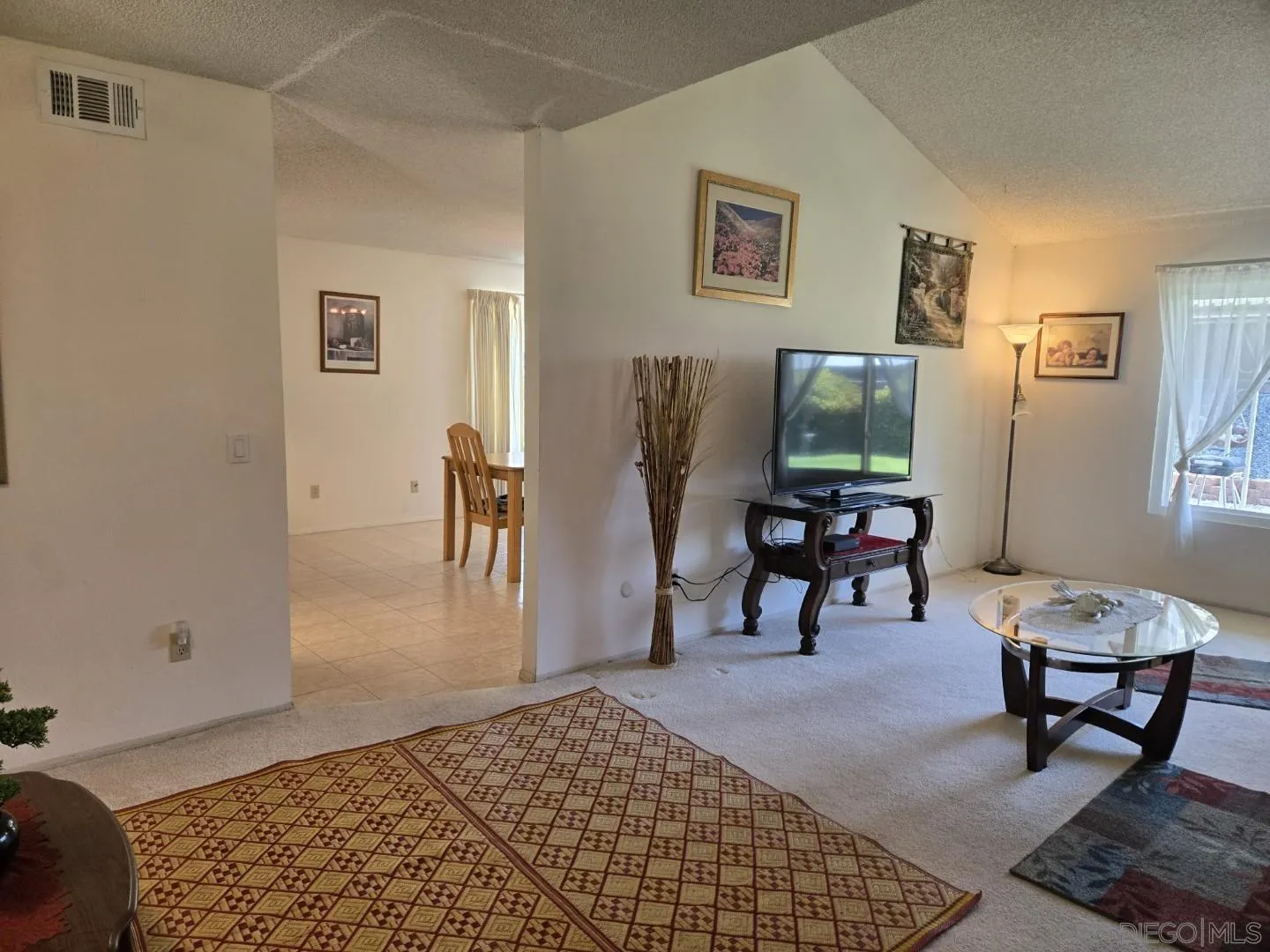 9343 Lake Hill Road Santee, CA 92071 - Photo 11 of 23 a living room with furniture and a rug