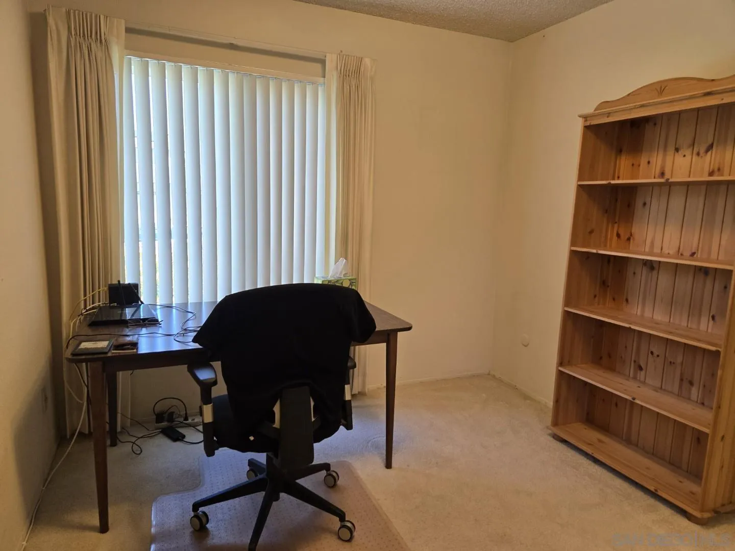 9343 Lake Hill Road Santee, CA 92071 - Photo 13 of 23 a view of a workspace with furniture and a window