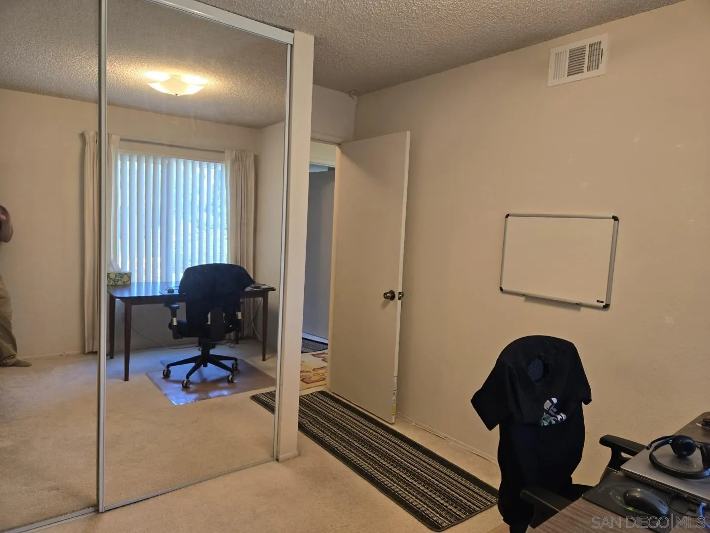 9343 Lake Hill Road Santee, CA 92071 - Photo 14 of 23 a view of a workspace with furniture and gym equipment