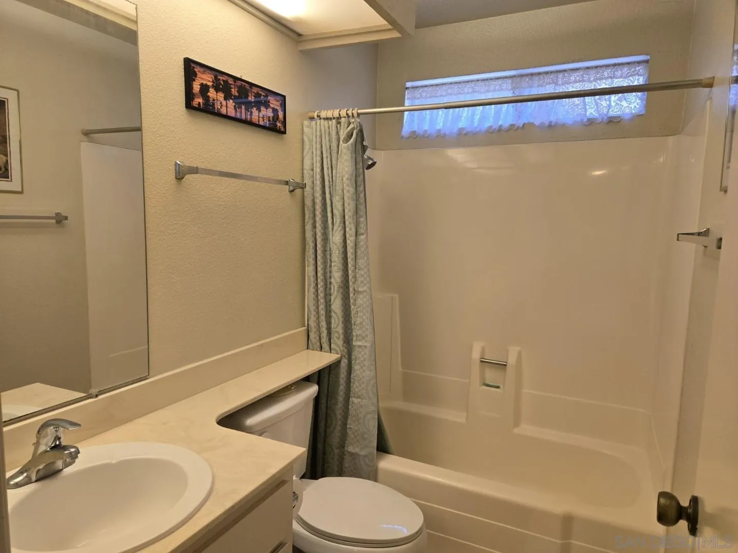 9343 Lake Hill Road Santee, CA 92071 - Photo 16 of 23 a bathroom with a sink toilet and shower