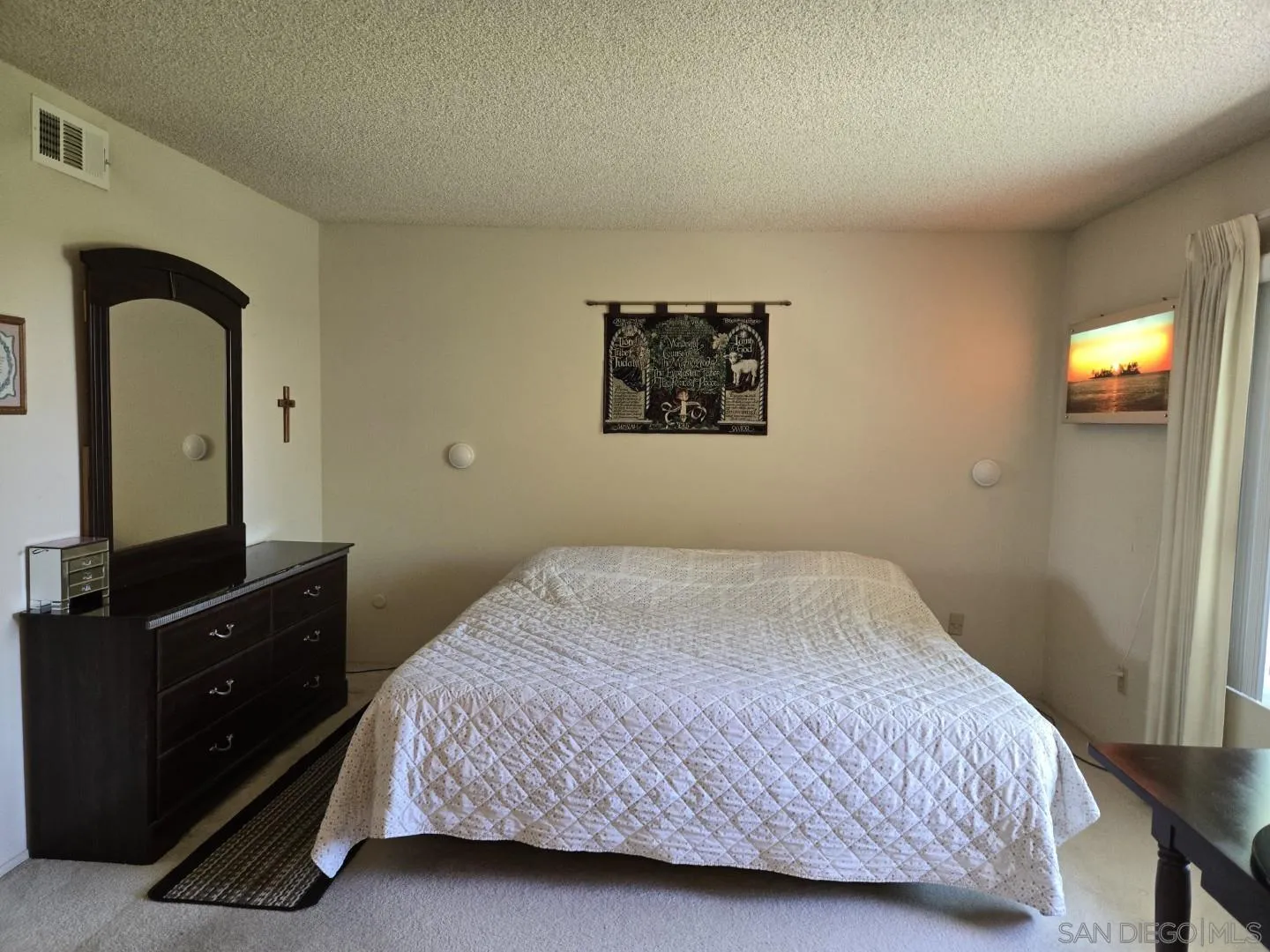 9343 Lake Hill Road Santee, CA 92071 - Photo 17 of 23 a bedroom with a bed and a flat tv screen on dresser