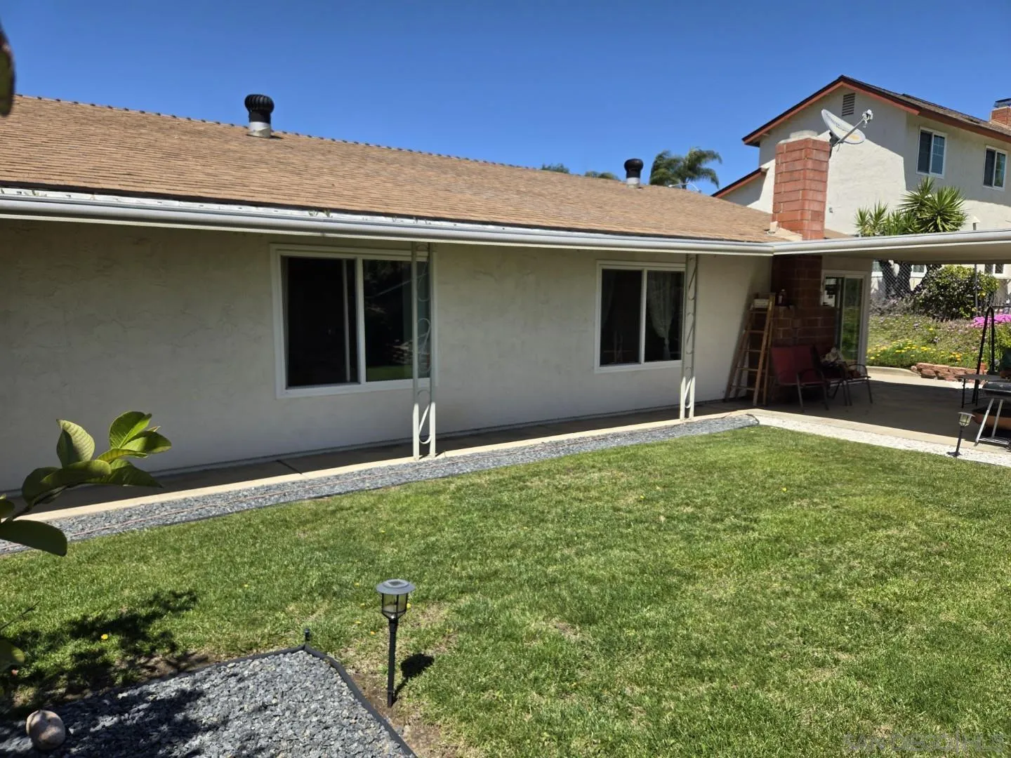 9343 Lake Hill Road Santee, CA 92071 - Photo 22 of 23 a front view of a house with a yard