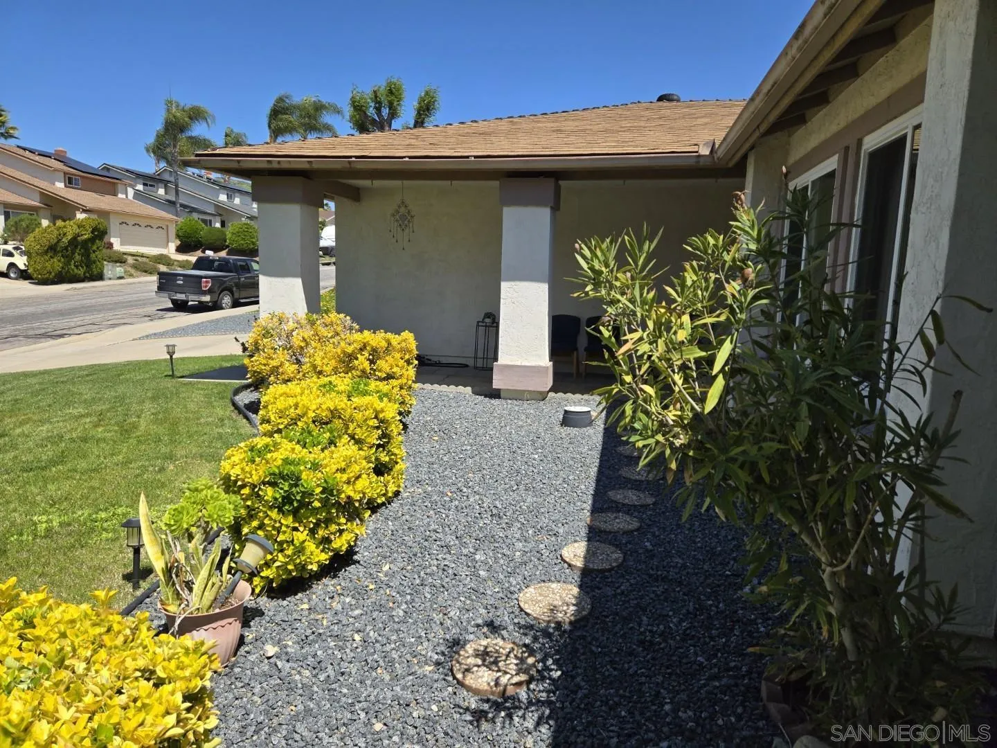 9343 Lake Hill Road Santee, CA 92071 - Photo 3 of 23 a front view of a house with lots of yellow lighting