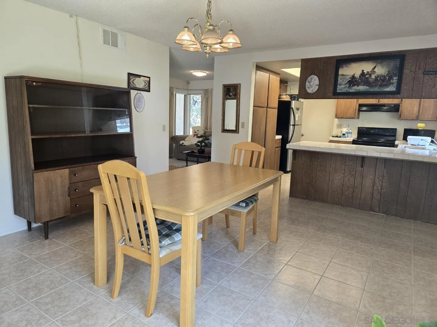 9343 Lake Hill Road Santee, CA 92071 - Photo 8 of 23 a dining room with furniture and window