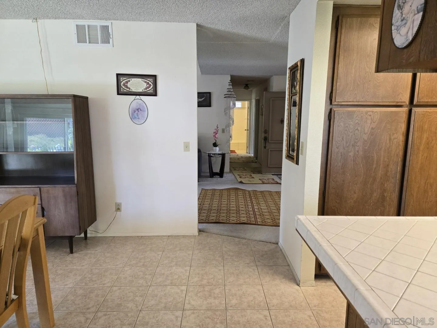 9343 Lake Hill Road Santee, CA 92071 - Photo 9 of 23 a kitchen with a refrigerator and a sink