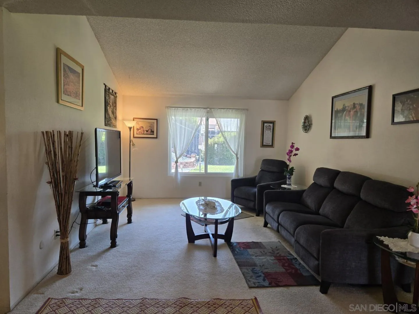 9343 Lake Hill Road Santee, CA 92071 - Photo 10 of 23 a living room with furniture and a large window