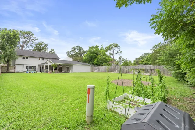 a front view of a house with a yard table and chairs
