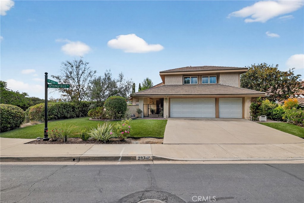 28741 Springfield Drive Laguna Niguel, CA 92677 - Photo 1 of 34 a front view of a house with a yard and potted plants