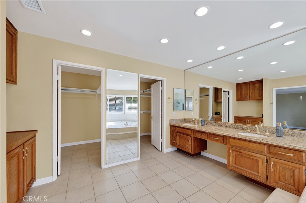 28741 Springfield Drive Laguna Niguel, CA 92677 - Photo 19 of 34 a large bathroom with a large tub and sink