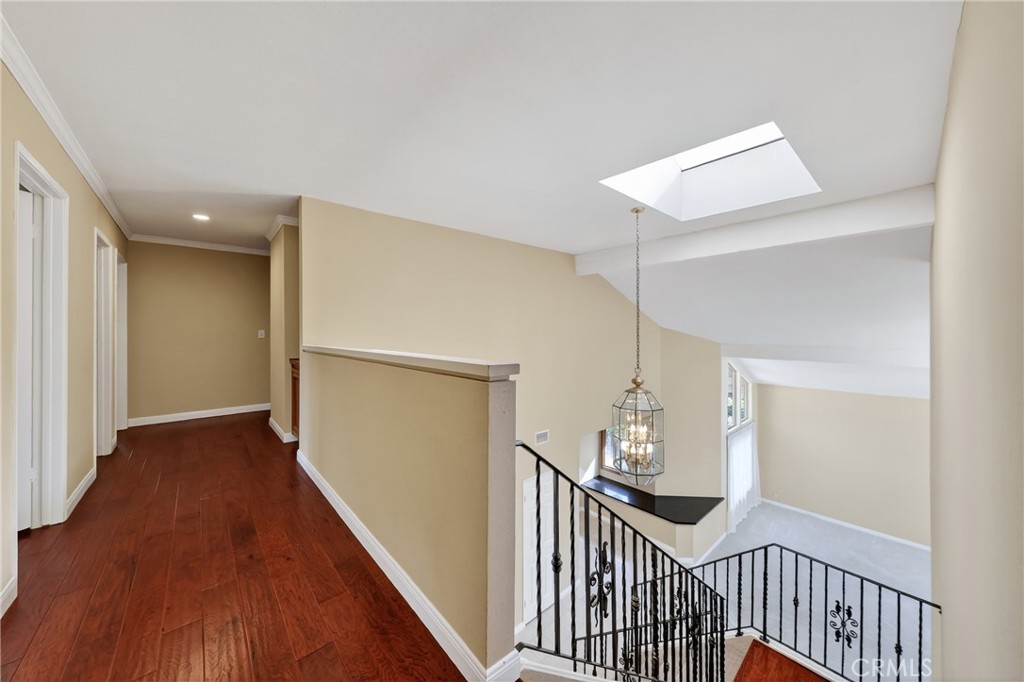 28741 Springfield Drive Laguna Niguel, CA 92677 - Photo 22 of 34 a view of a hallway view with wooden floor and stairs
