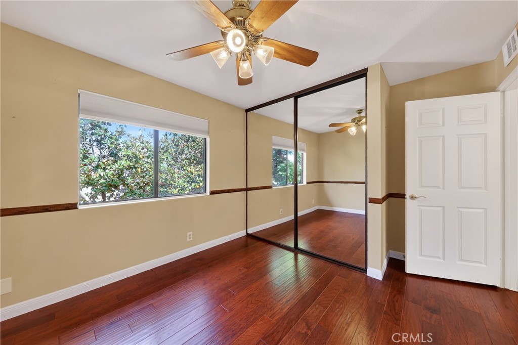 28741 Springfield Drive Laguna Niguel, CA 92677 - Photo 23 of 34 an empty room with wooden floor fan and windows