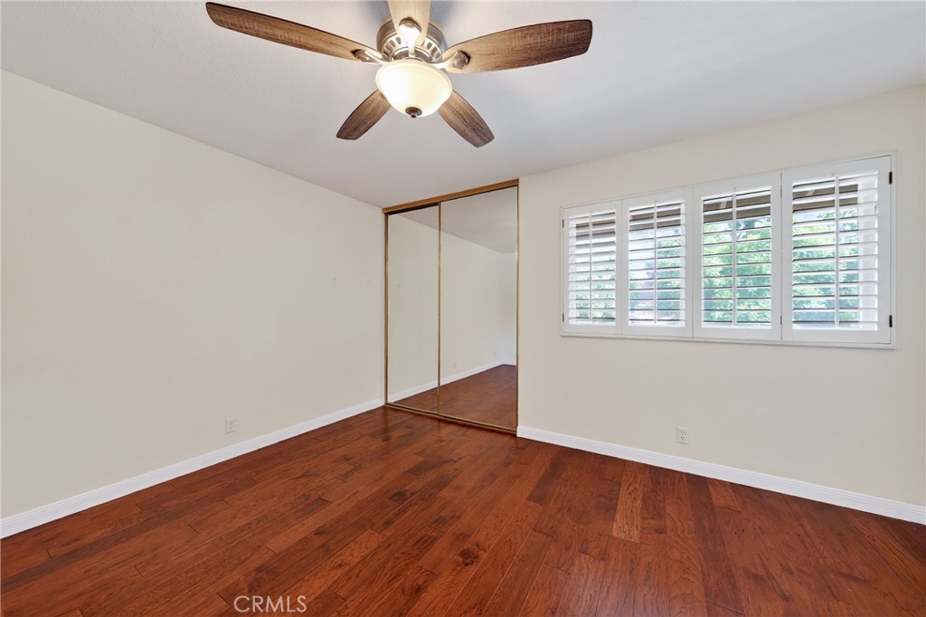 28741 Springfield Drive Laguna Niguel, CA 92677 - Photo 25 of 34 an empty room with wooden floor fan and windows