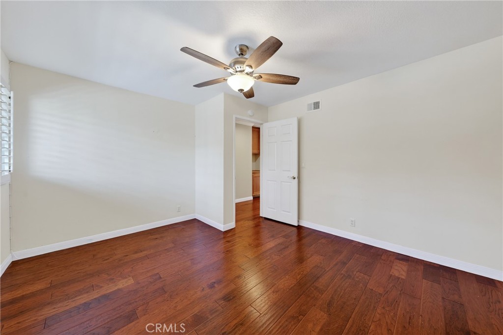 28741 Springfield Drive Laguna Niguel, CA 92677 - Photo 26 of 34 a view of an empty room with wooden floor