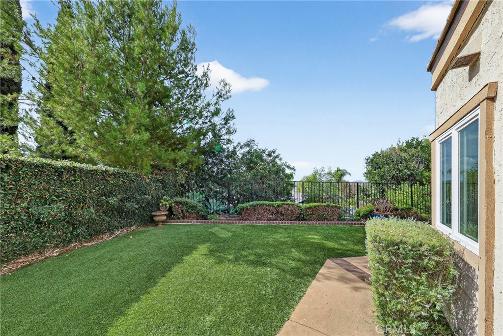 28741 Springfield Drive Laguna Niguel, CA 92677 - Photo 31 of 34 a view of a garden with a building in the background