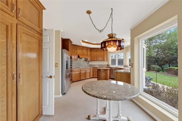 a view of a dining room with furniture wooden floor and a yard