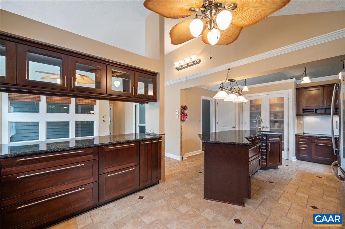 716 Preddy Creek Road Barboursville, VA 22923 - Photo 12 of 73 a kitchen with stainless steel appliances granite countertop a stove and cabinets