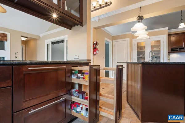 a kitchen with stainless steel appliances granite countertop a refrigerator and a stove