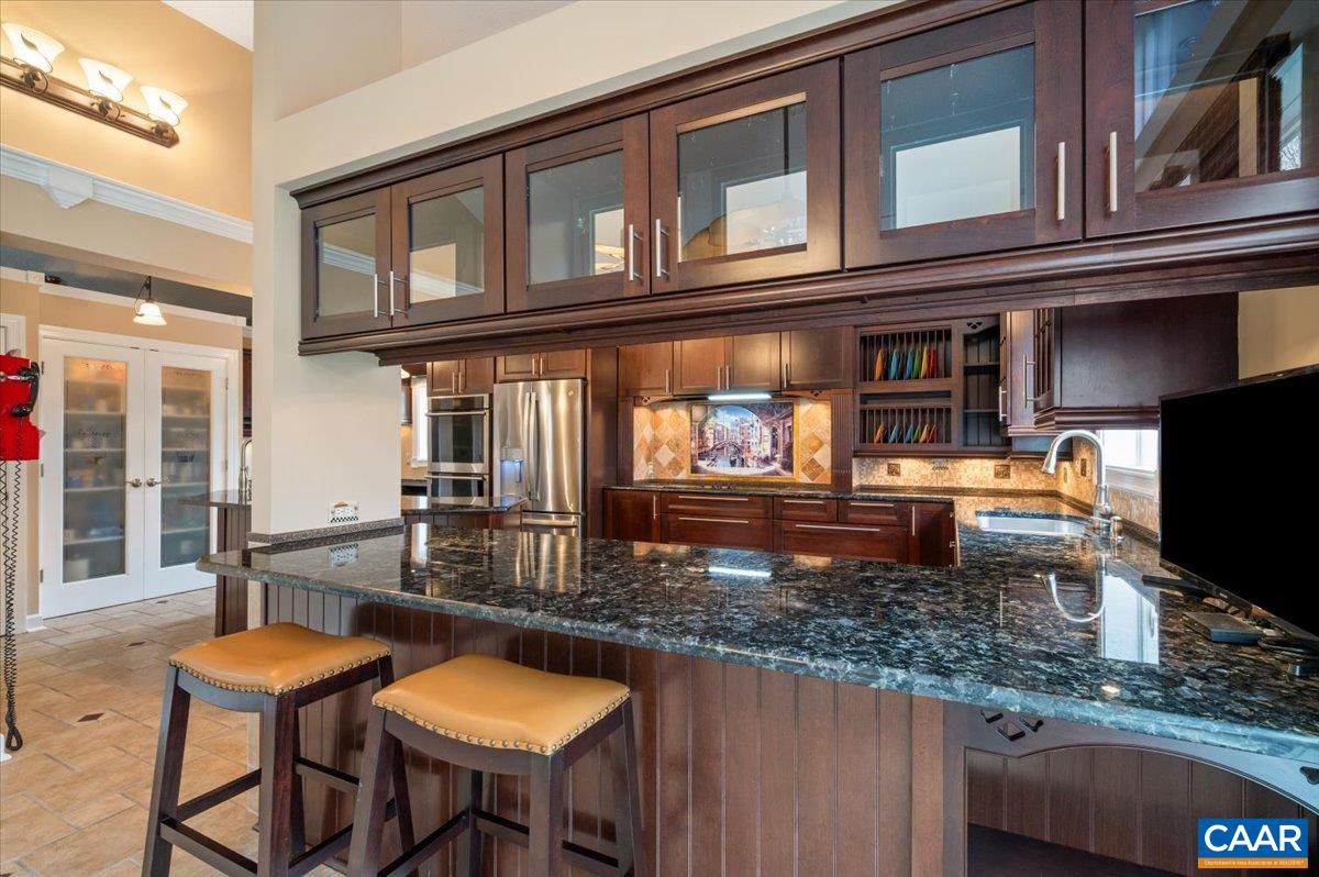 716 Preddy Creek Road Barboursville, VA 22923 - Photo 24 of 73 a backyard of a house with barbeque oven table and chairs