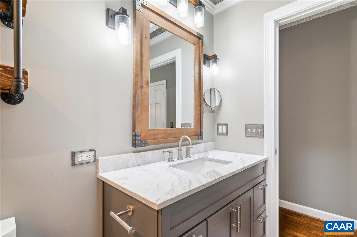 716 Preddy Creek Road Barboursville, VA 22923 - Photo 27 of 73 a bathroom with a sink and a mirror