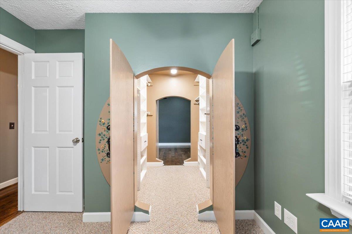 716 Preddy Creek Road Barboursville, VA 22923 - Photo 30 of 73 a view of a hallway with wooden floor and staircase