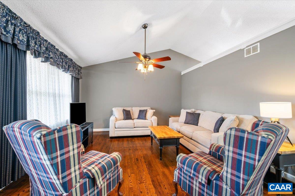 716 Preddy Creek Road Barboursville, VA 22923 - Photo 3 of 73 a living room with furniture a flat screen tv and a window