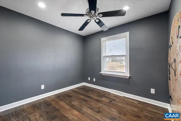 a view of bedroom with furniture and windows