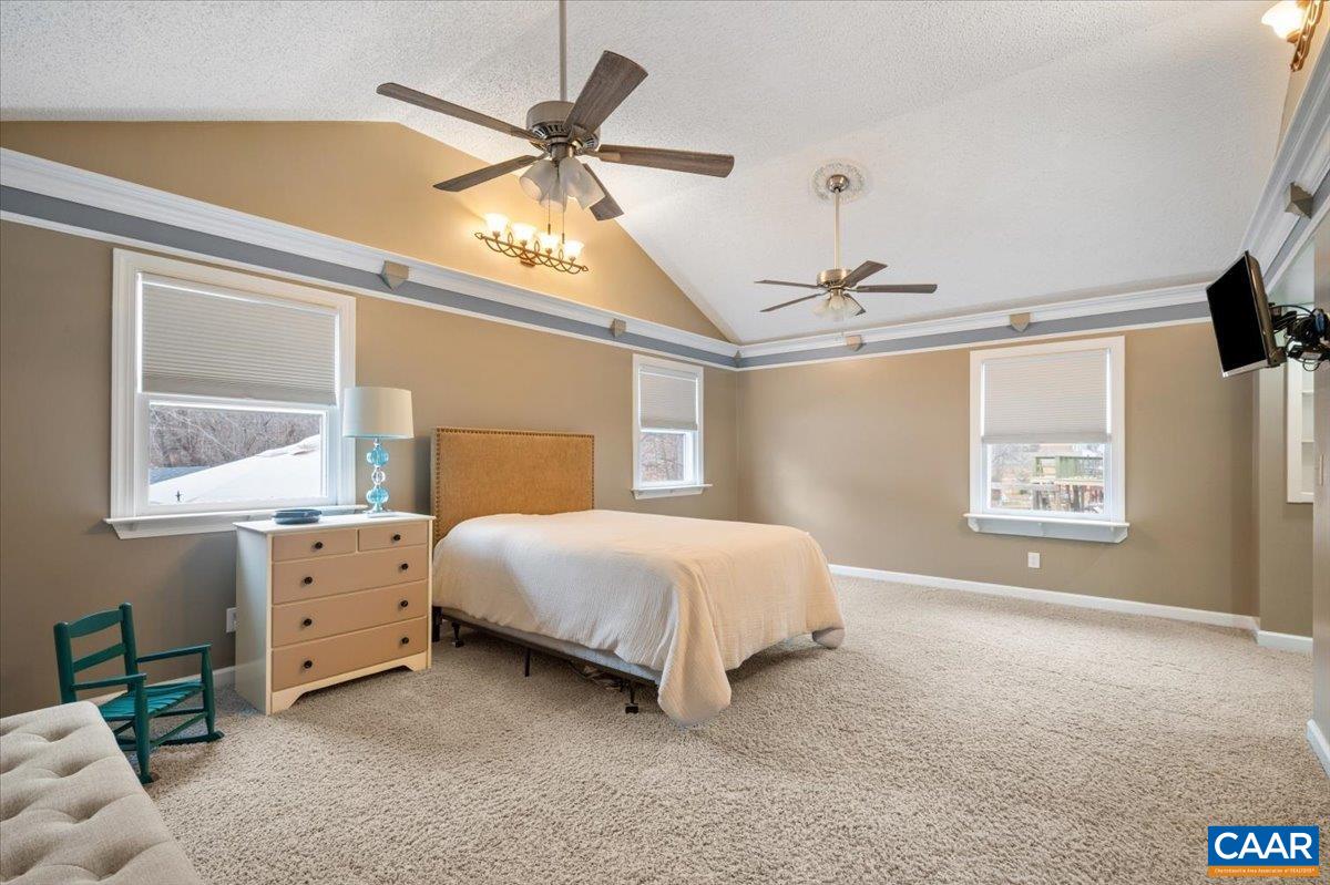 716 Preddy Creek Road Barboursville, VA 22923 - Photo 35 of 73 a spacious bedroom with a bed and a window