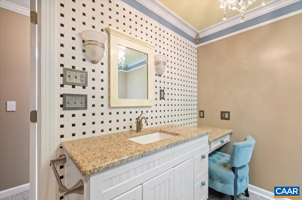 716 Preddy Creek Road Barboursville, VA 22923 - Photo 39 of 73 a bathroom with a granite countertop sink a mirror and a shower