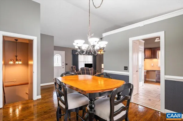 a dining room with a table and chairs