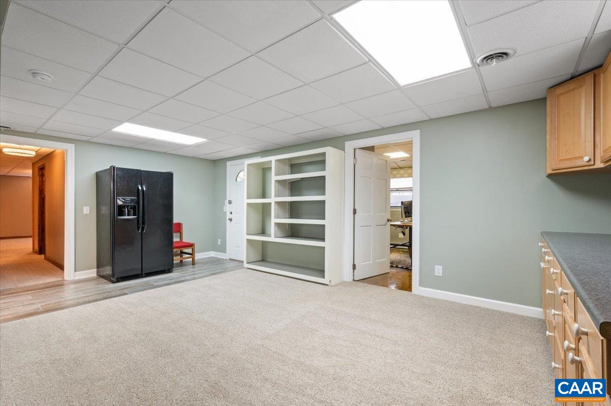 716 Preddy Creek Road Barboursville, VA 22923 - Photo 52 of 73 a view of an empty room with a cabinet and a window