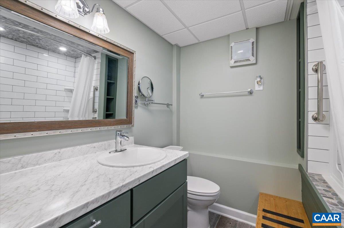 716 Preddy Creek Road Barboursville, VA 22923 - Photo 59 of 73 a bathroom with a granite countertop sink toilet and shower
