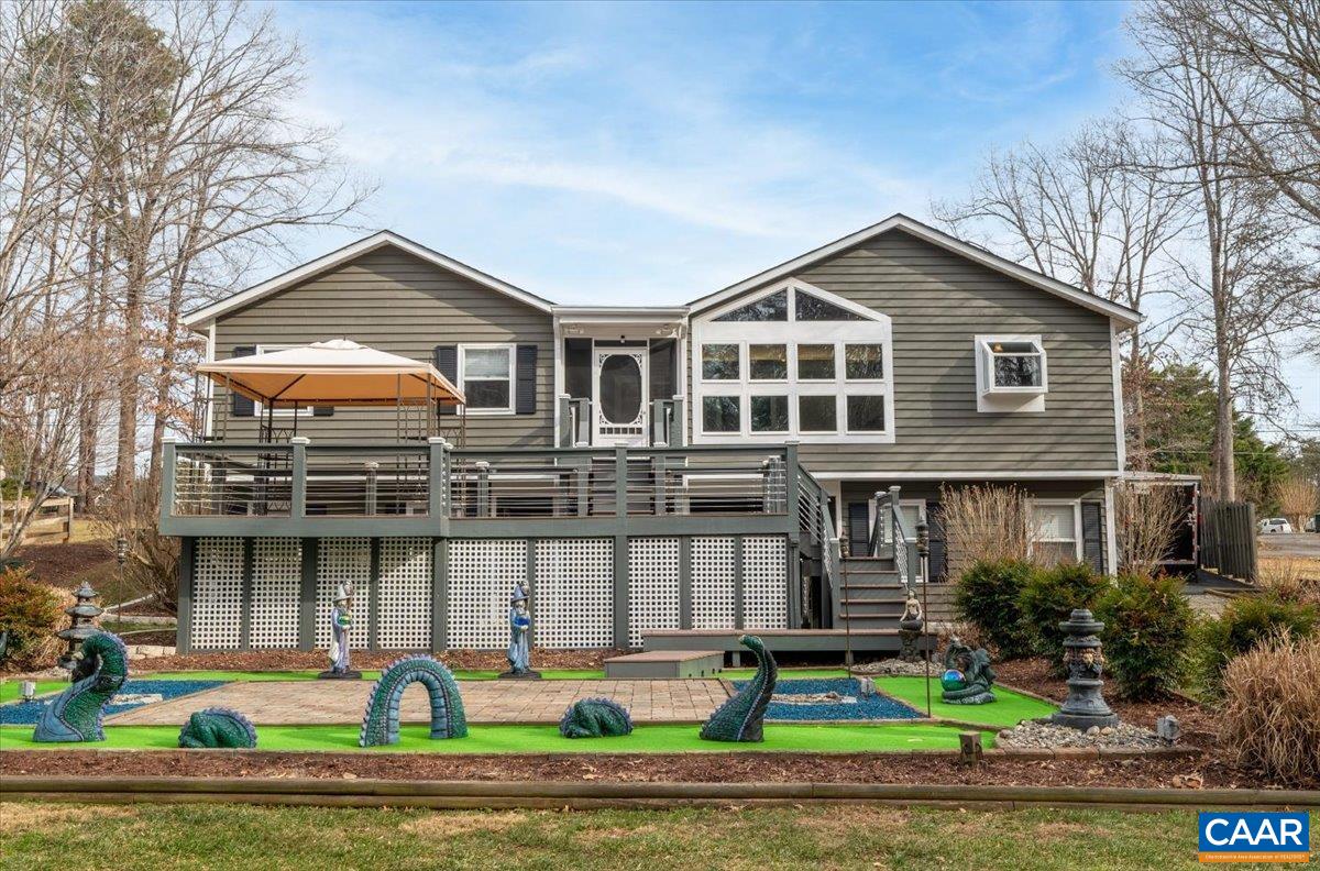 716 Preddy Creek Road Barboursville, VA 22923 - Photo 71 of 73 a front view of a house with a yard and potted plants