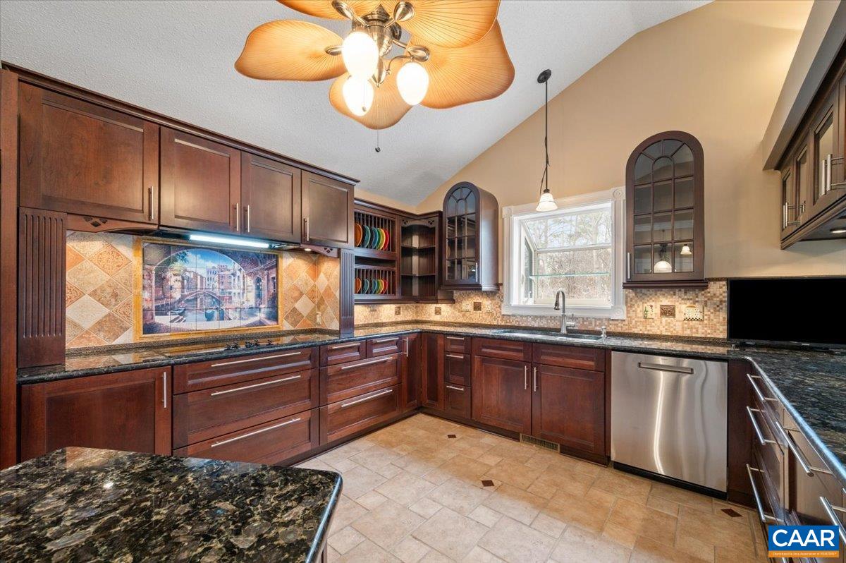 716 Preddy Creek Road Barboursville, VA 22923 - Photo 8 of 73 a kitchen with stainless steel appliances granite countertop a stove and cabinets