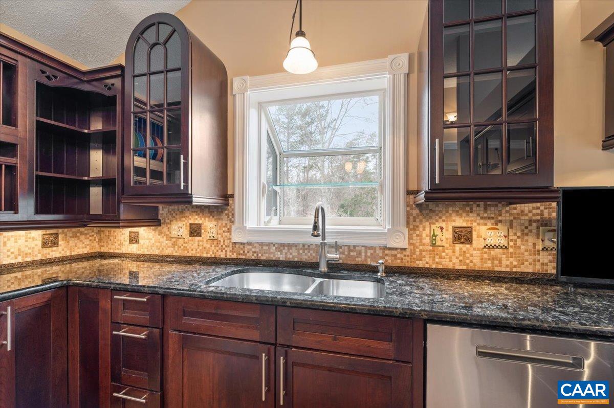 716 Preddy Creek Road Barboursville, VA 22923 - Photo 9 of 73 a kitchen with granite countertop a sink and a window