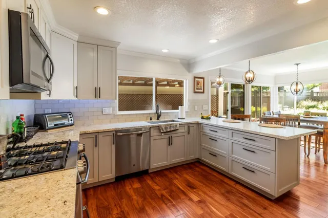 a kitchen with a sink and a window