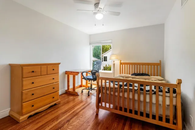 a bedroom with a bed and a chair