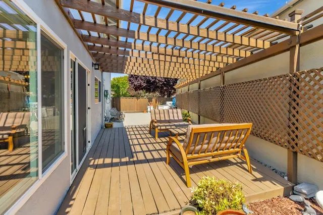a patio with patio outdoor seating and barbeque oven