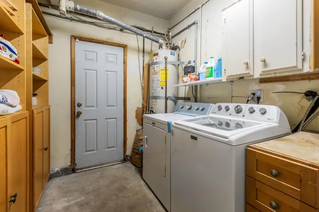 an aerial view of multiple houses with yard