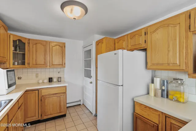 a kitchen with a refrigerator a sink and dishwasher