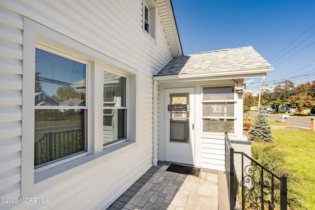 a front view of a house with a porch