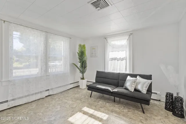 a living room with furniture and a window