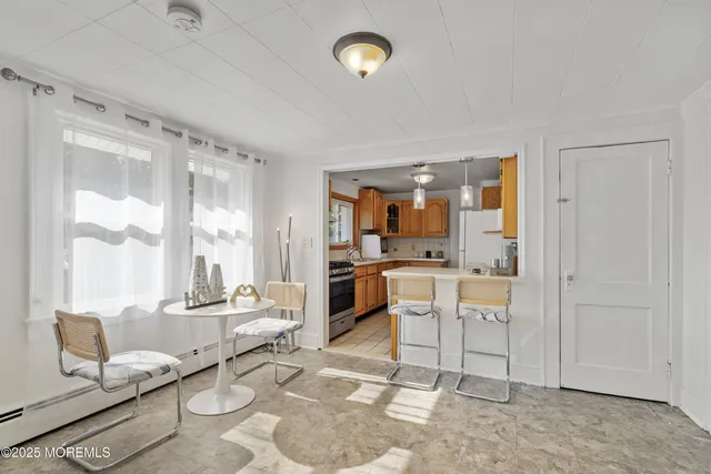 a living room with furniture a rug and a large window