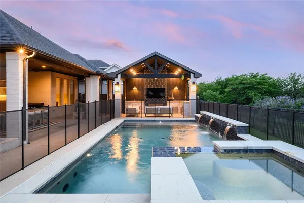 a view of a swimming pool with a patio