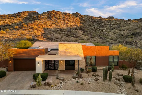 a terrace of a house with outdoor seating