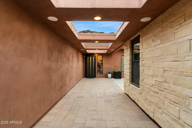 a lobby with furniture and window