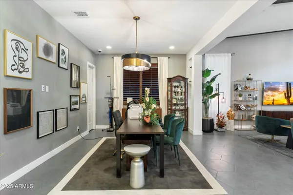 a living room with furniture flat screen tv and a large window