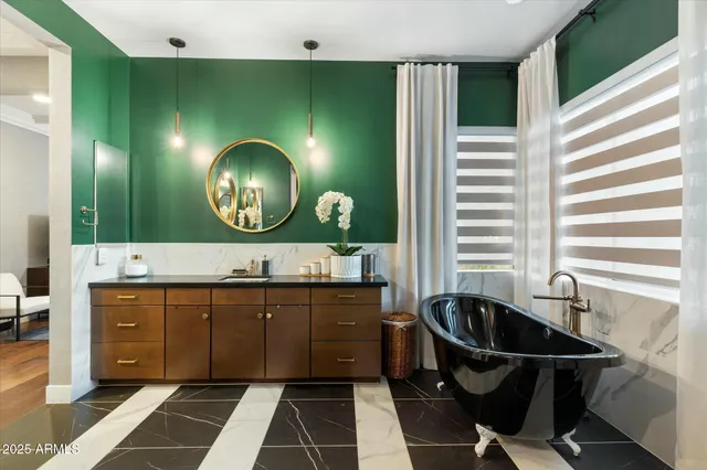 a bedroom with a bed and a mirror